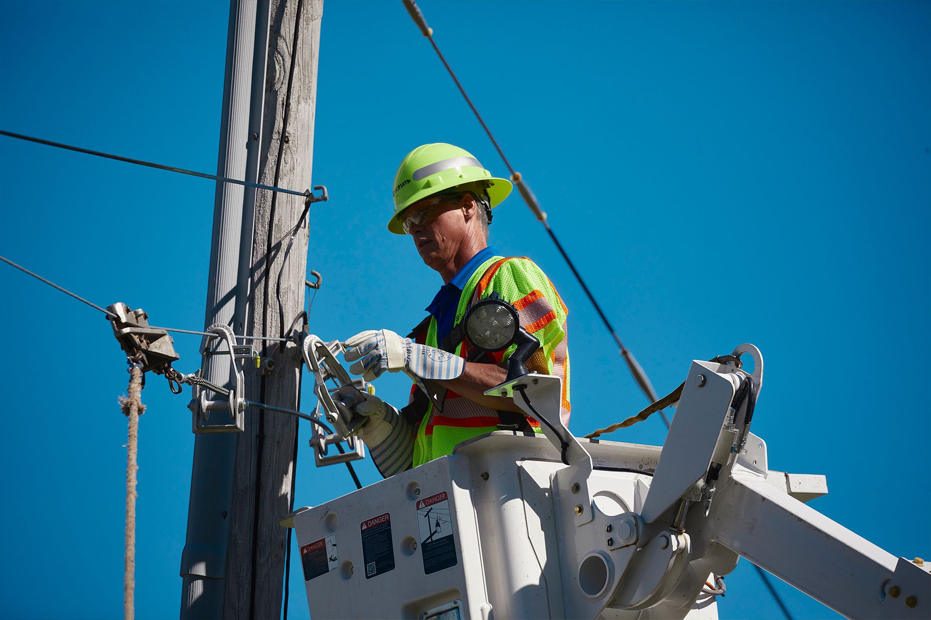 Worker on telephone pole