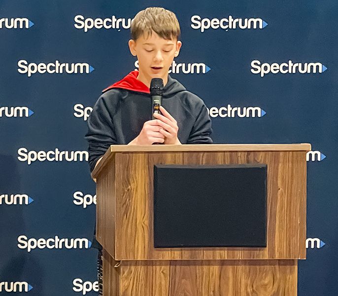 Student Jeffrey Guy speaks at the podium during an event held at the Boys & Girls Club of Elizabethton/Carter County