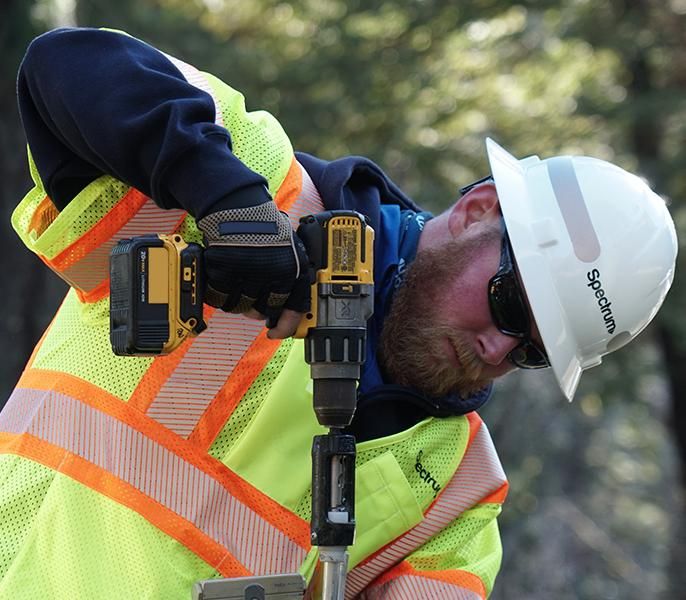 Spectrum Technician making last mile connection to local network